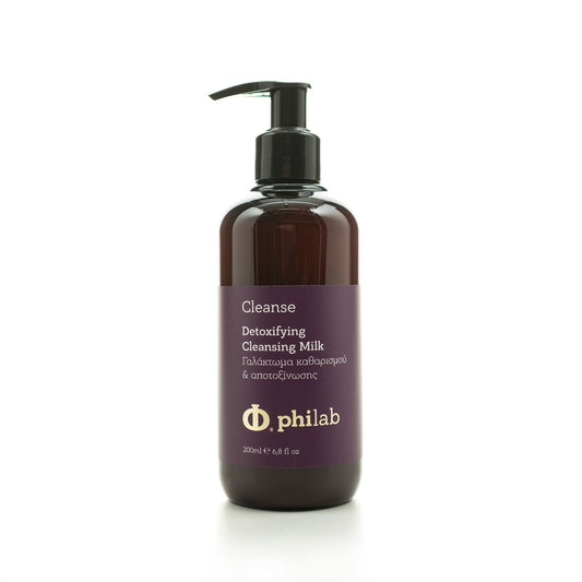 Philab dark amber bottle of Detoxifying Cleansing Milk with pump dispenser on white background.