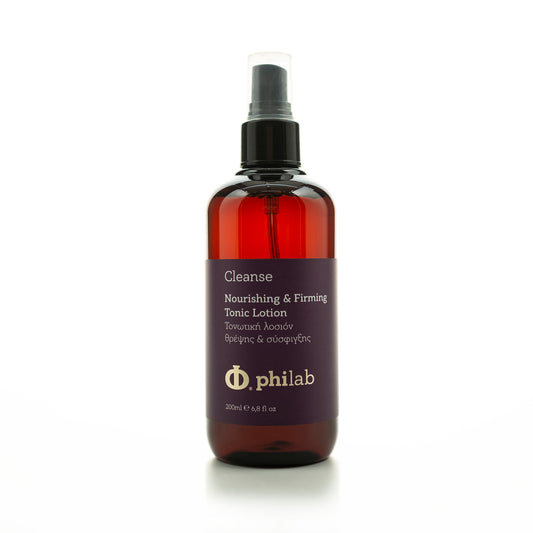 Philab dark amber bottle of Nourishing & Firming Tonic Lotion with spray nozzle on white background.